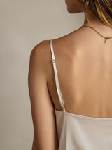 White silk spaghetti strap camisole with adjustable strap and low back