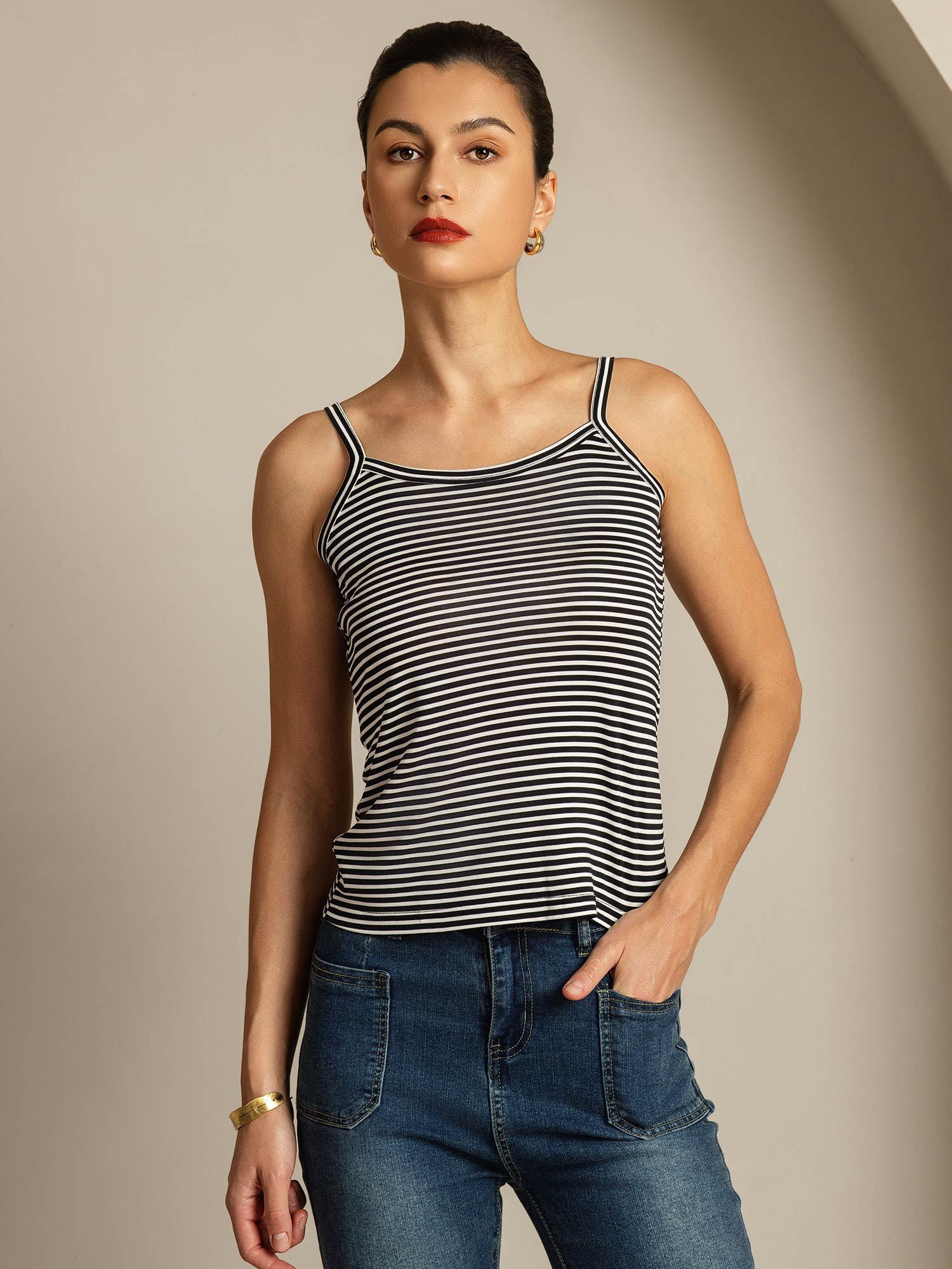 Model wearing black and white striped silk spaghetti strap camisole top