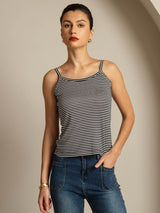Model wearing black and white striped silk spaghetti strap camisole top