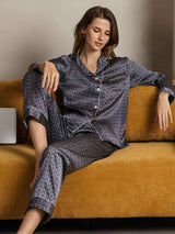 Woman wearing navy mulberry silk ginkgo print long sleeve notch collar pajama set