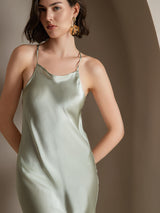 Light green silk spaghetti strap maxi dress on model