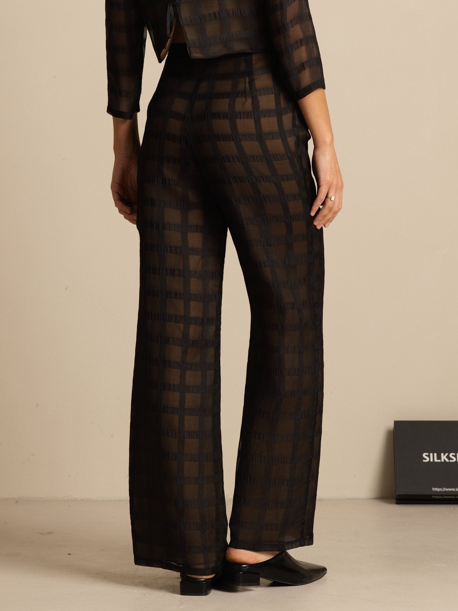 Black sheer silk wide-leg pants with textured grid jacquard and high waist