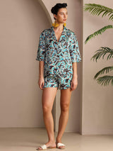 Women’s botanical print silk pajama set with short-sleeve button-up top and shorts