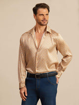 Man wearing orange geometric print silk lapel-collar shirt with long sleeves
