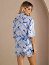 Women’s blue leaf print silk pajama set with short sleeve button-up shirt and shorts