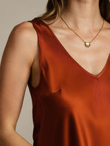 Rust silk sleeveless V-neck tank top with V back design