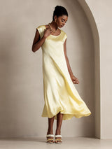 Yellow silk midi dress with round neck and cap sleeves, flowing straight fit