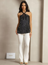 Black silk polka dot halter top with twist front and keyhole back